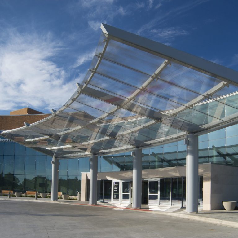 Building entrance with glass awning