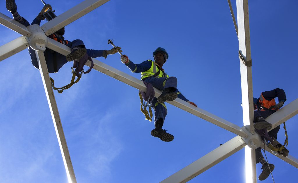 People working in an elevated structure