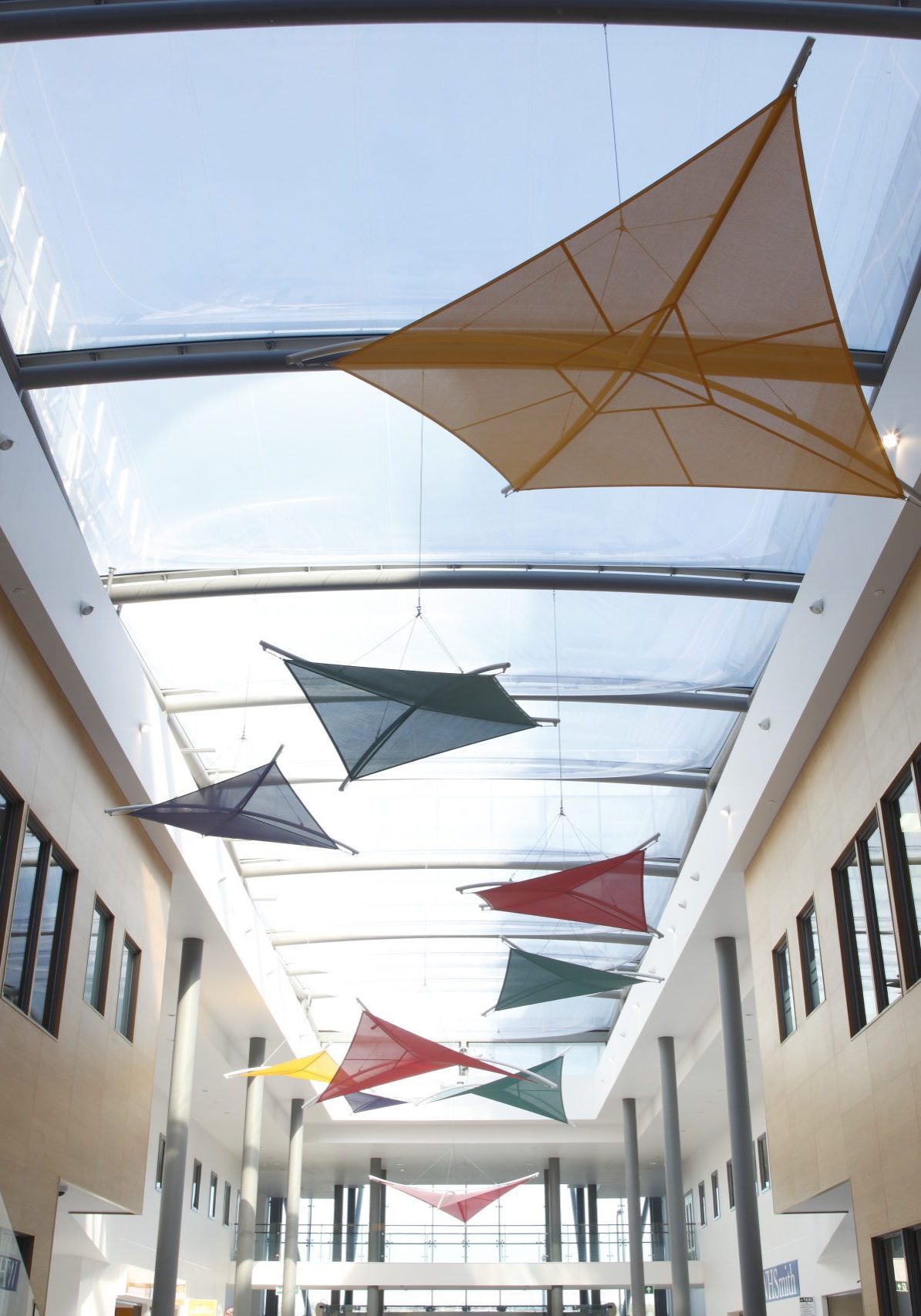 Long atrium with cable tensioned fabric roof