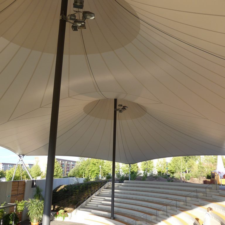 Cable tensioned fabric structure